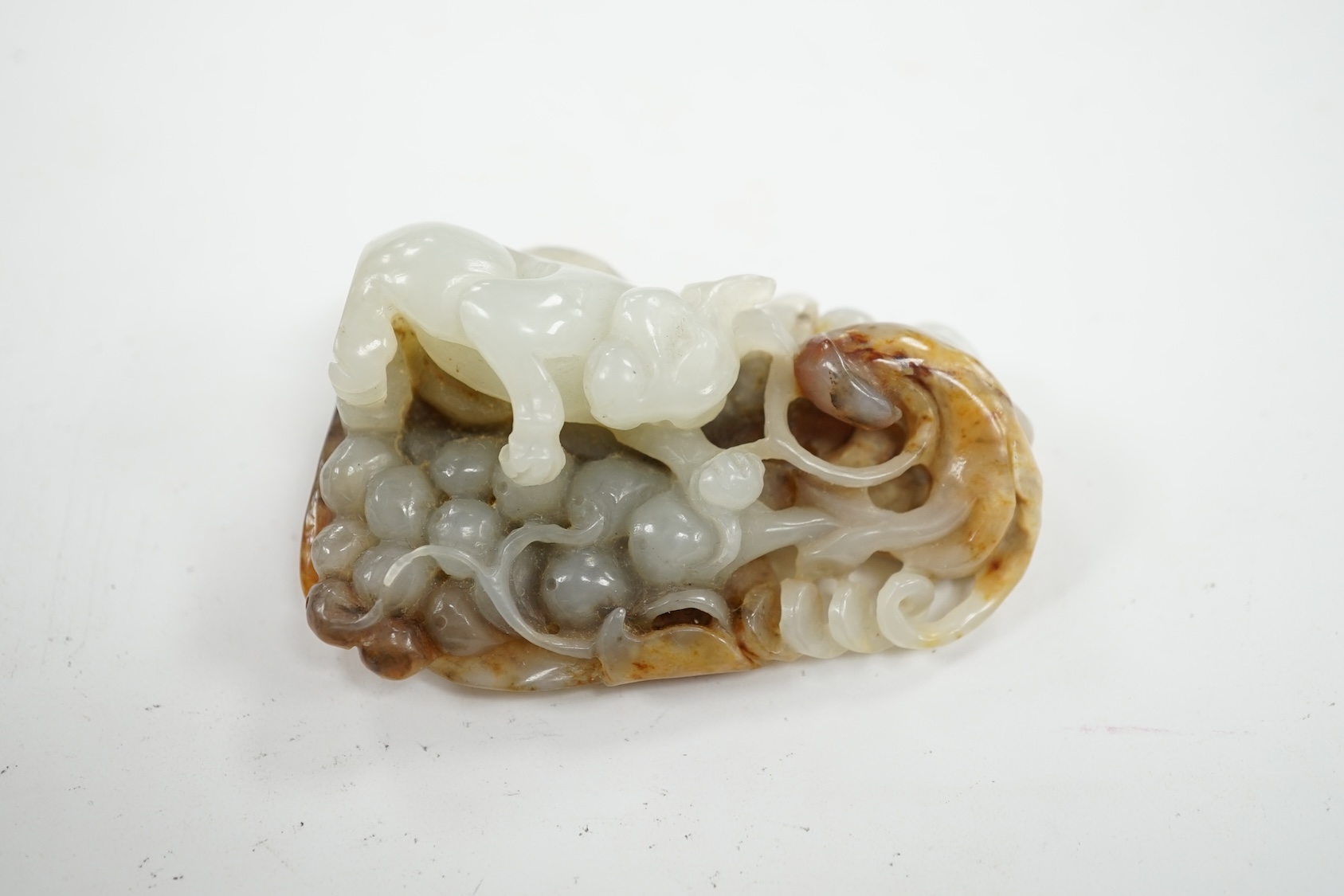 A Chinese russet jade carving of an animal, 6cm high. Condition - good